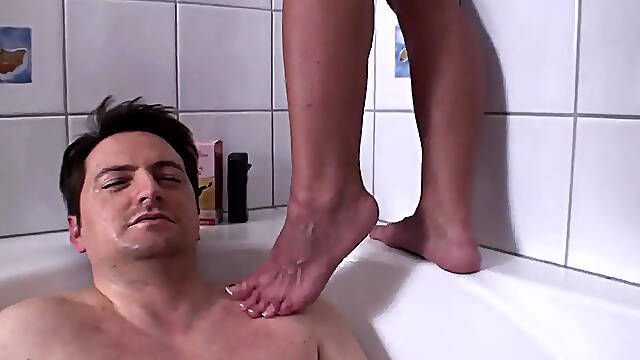 Two female slaves pee on each other in degrading scene