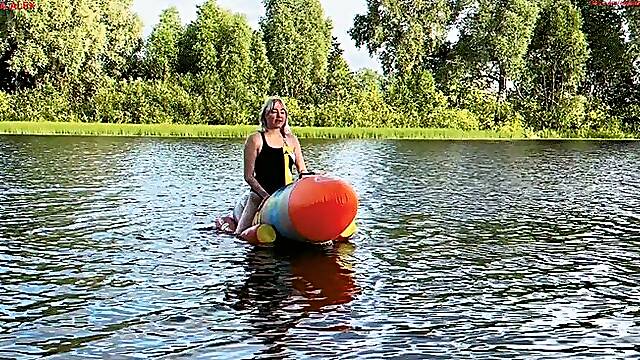 Alla hotly fucks a big inflatable rocket on the lake