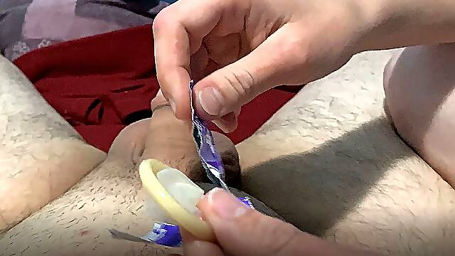 She jerks me off with a condom and I cum inside